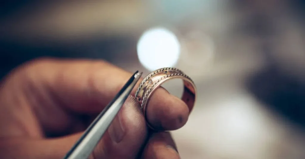 Jeweler crafting gold ring