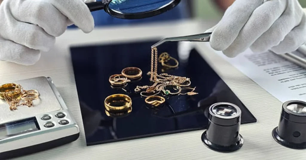 Jeweler evaluating gold purity